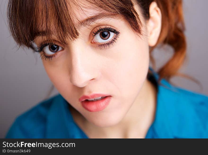 Close up beautiful young woman with big eyes