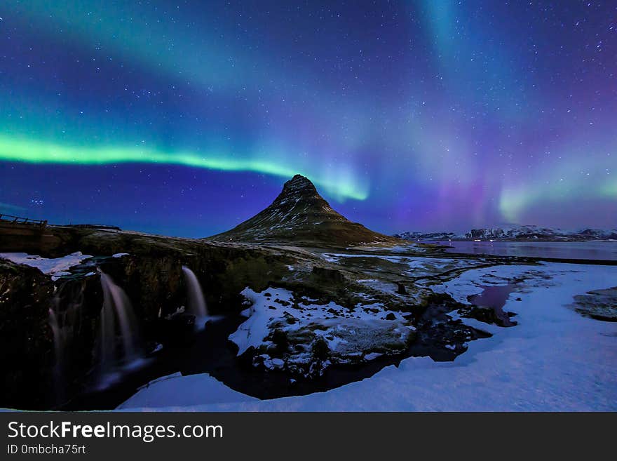 Mountain Kirkjufell and Aurora in Iceland.