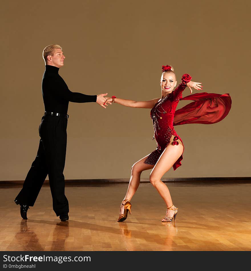 Latino Dance Couple In Action Preforming A Exhibition Dance - W