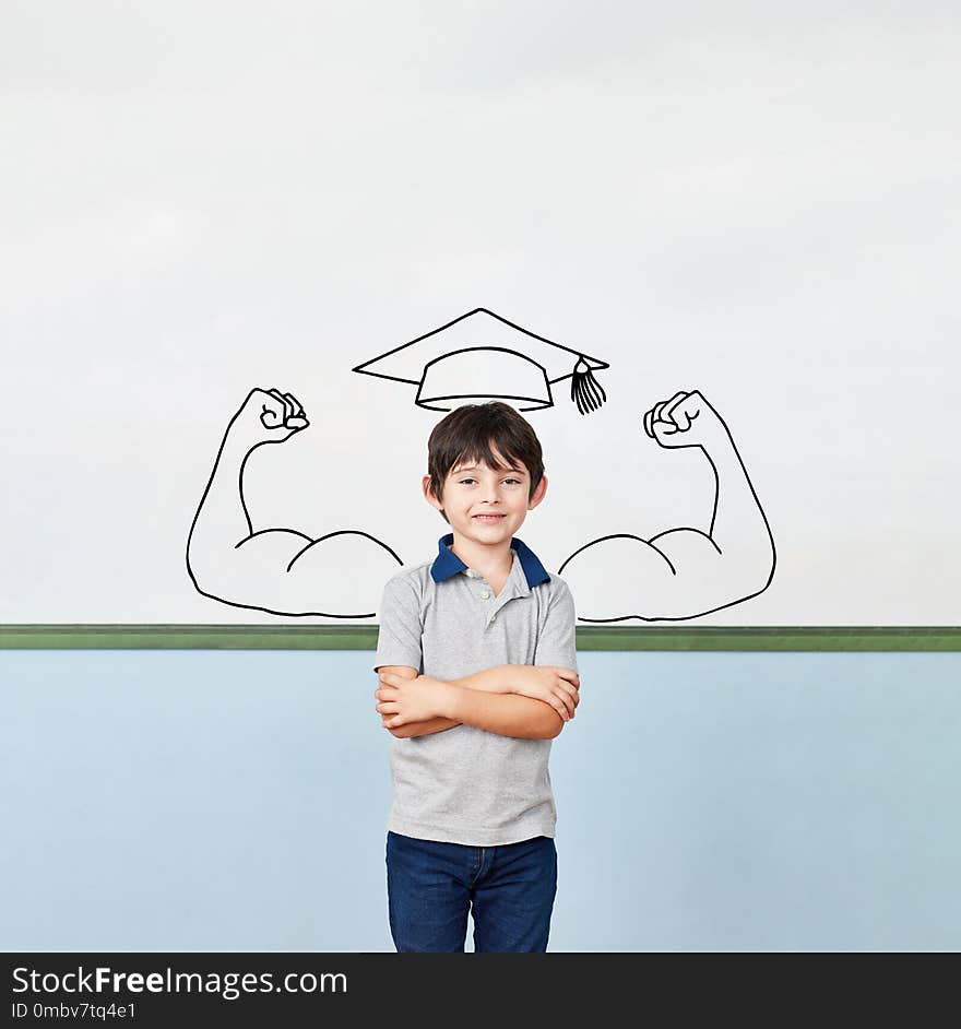 Proud student in elementary school in front of a whiteboard with muscles and mortarboard. Proud student in elementary school in front of a whiteboard with muscles and mortarboard