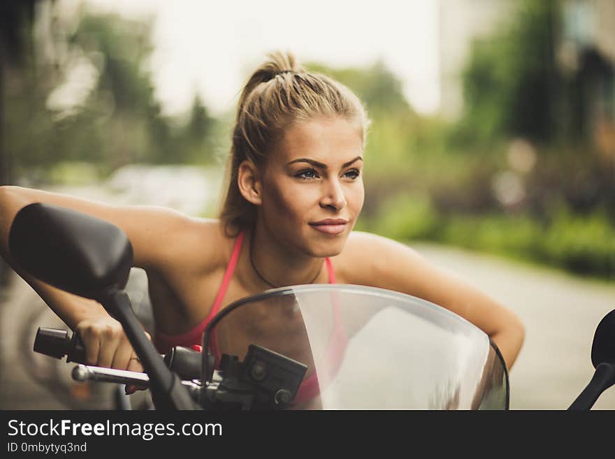 Portrait of beauty young women at her bike.