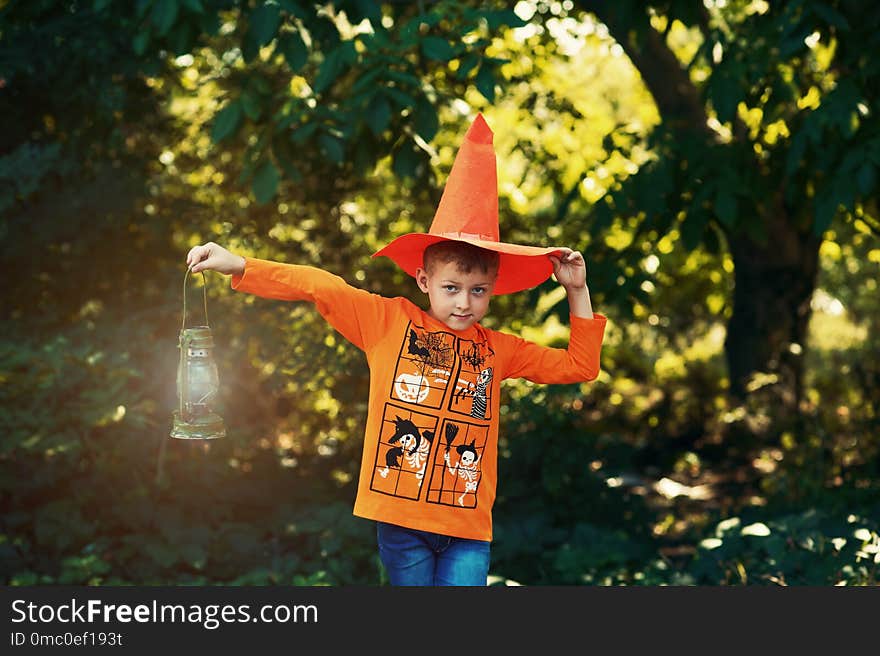 Boy on Halloween day with a lantern in his hands . Boy on Halloween day with a lantern in his hands .