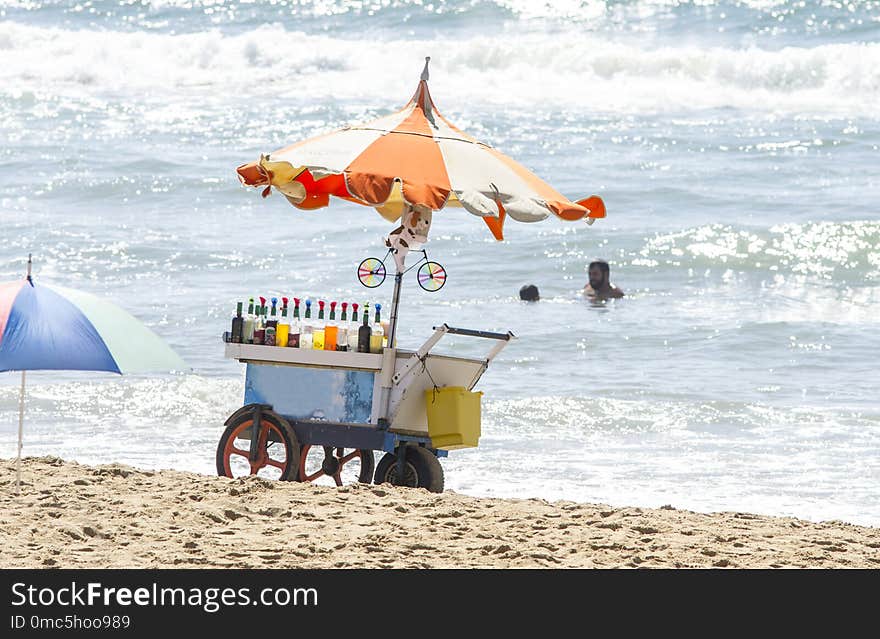 Vintage vehicle selling drinks on a beach