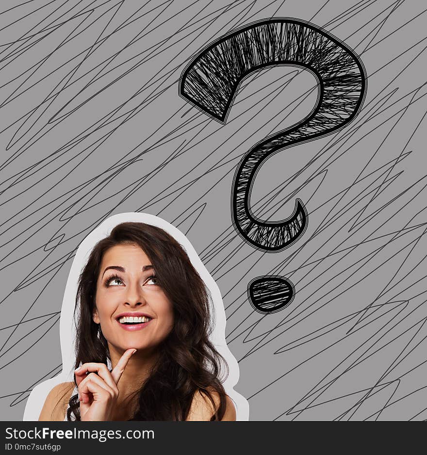 Thinking smiling positive woman looking up on one big creative question marks above the head on grey background. Closeup portiat with sketch illustration