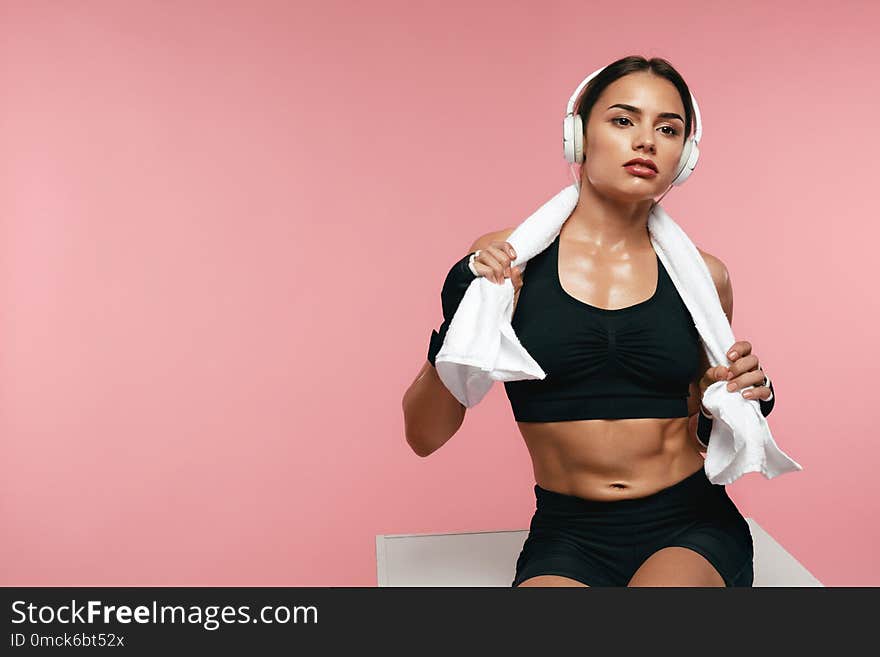 Sport Woman Listening Music In Headphones On Training, Enjoying Song In Earphones. High Resolution