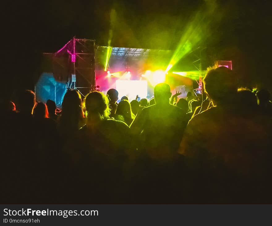 Crowd raising their hands and enjoying great festival party or concert.