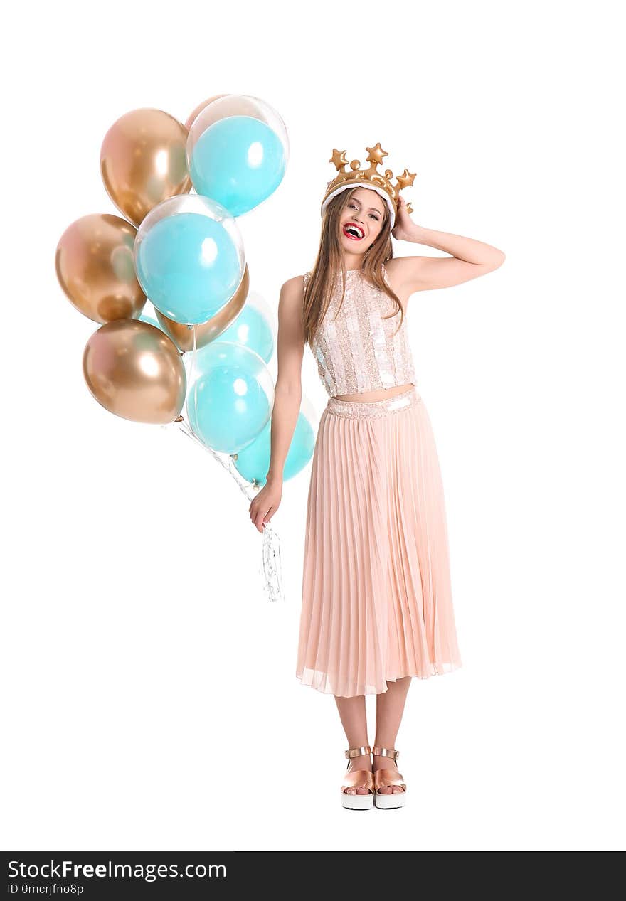 Young woman with crown and air balloons on white background