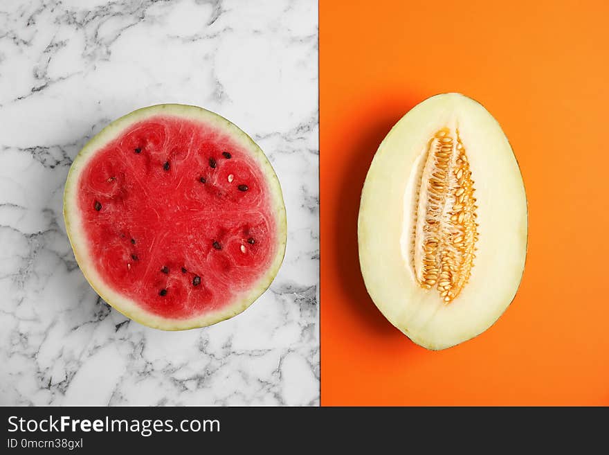 Flat lay composition with melon and watermelon on color background