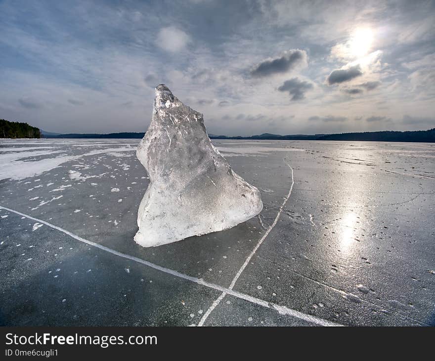 Melting of pieces of thick ice on frozen sea. Hot sun