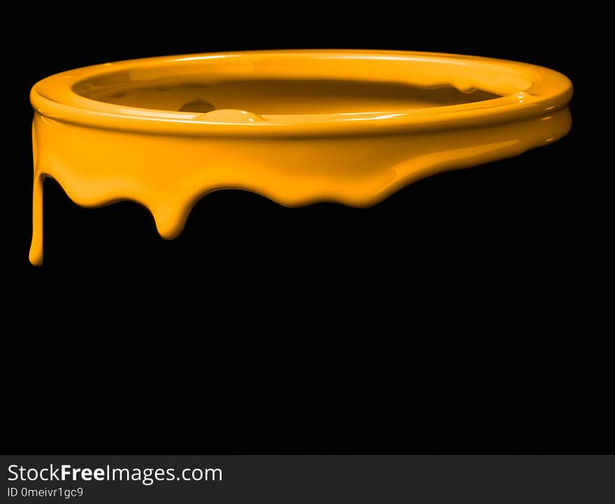 Colorful paint leaking down on wall of metal bucket. Isolated over black background. Colorful paint leaking down on wall of metal bucket. Isolated over black background