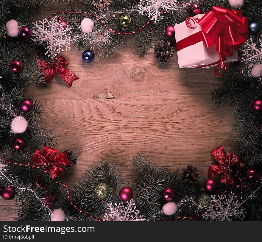 Christmas wreath and gift on wooden background .photo with place for text .