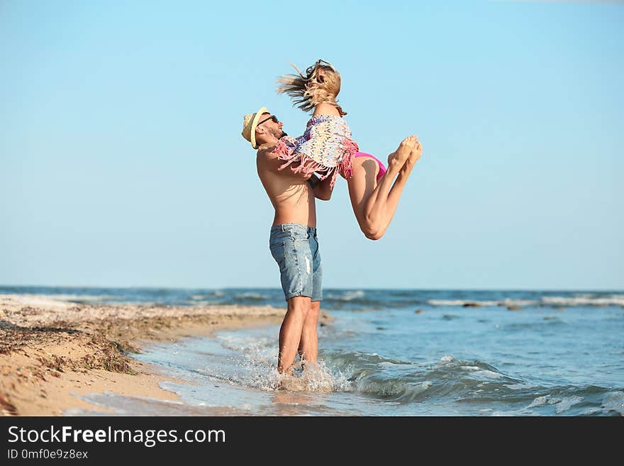 Young couple spending time together on beach