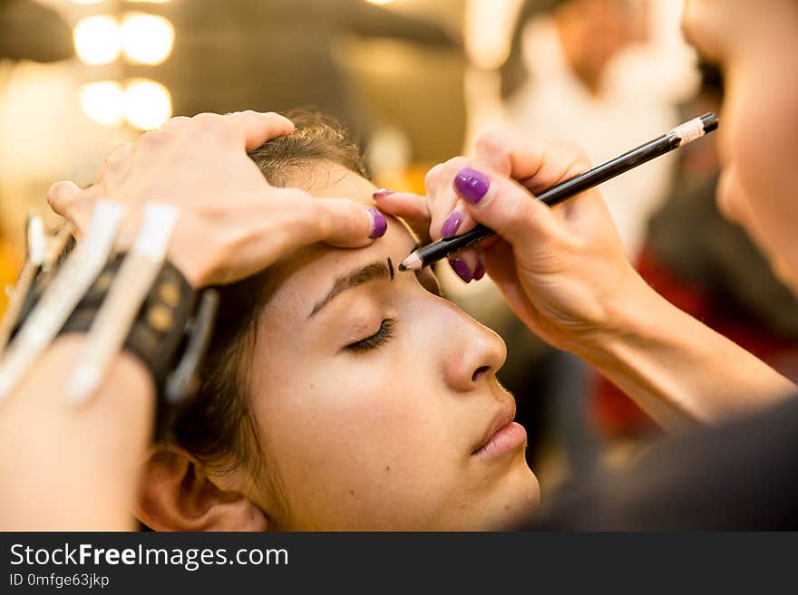 Young women doing makeup , old-fashioned. Backstage.