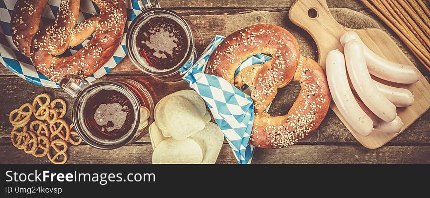 Oktoberfest Concept - Traditional Food And Beer On Rustic Background