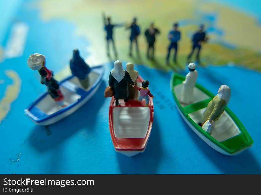 Miniature people concept of Middle Eastern people arrive by boat to the border of USA.