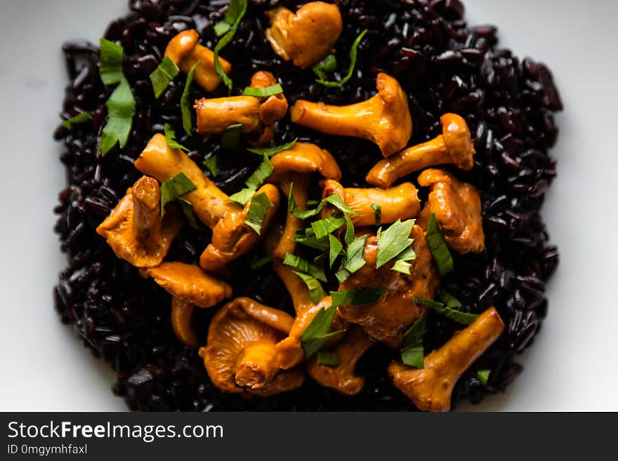 Healthy seared girolles mushrooms with black rice