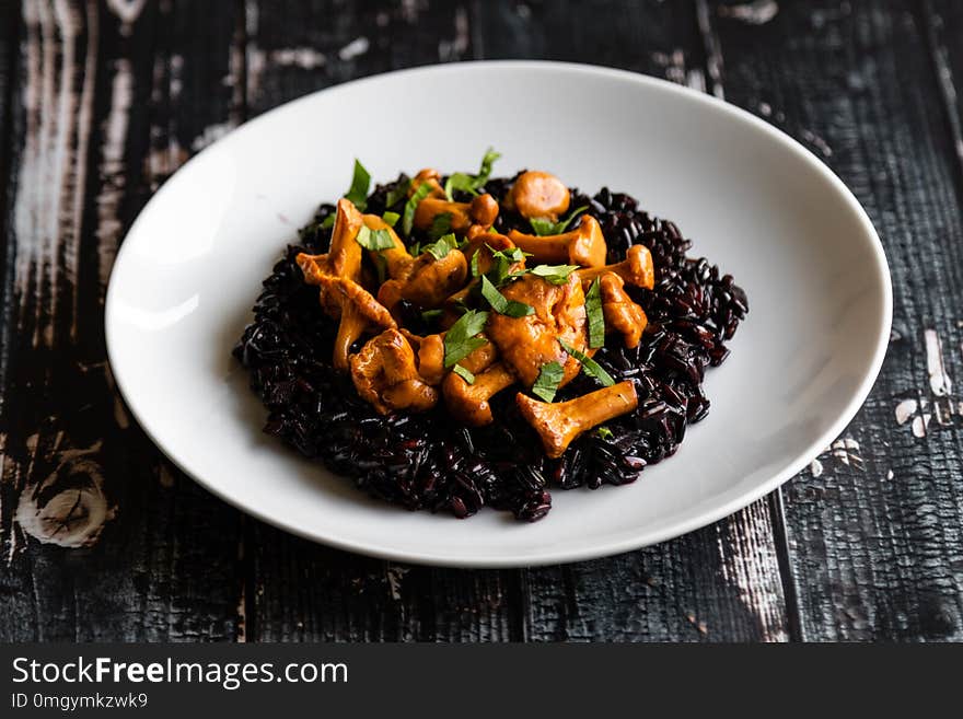 Healthy seared girolles mushrooms with black rice