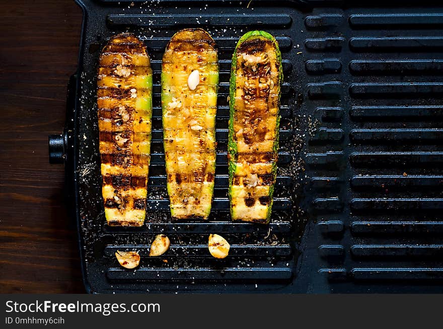 Spicy hot grilled zucchini, cooked on an electric grill. Banner. The concept of healthy eating and delicious food.Top view, copy space, flat lay,closeup