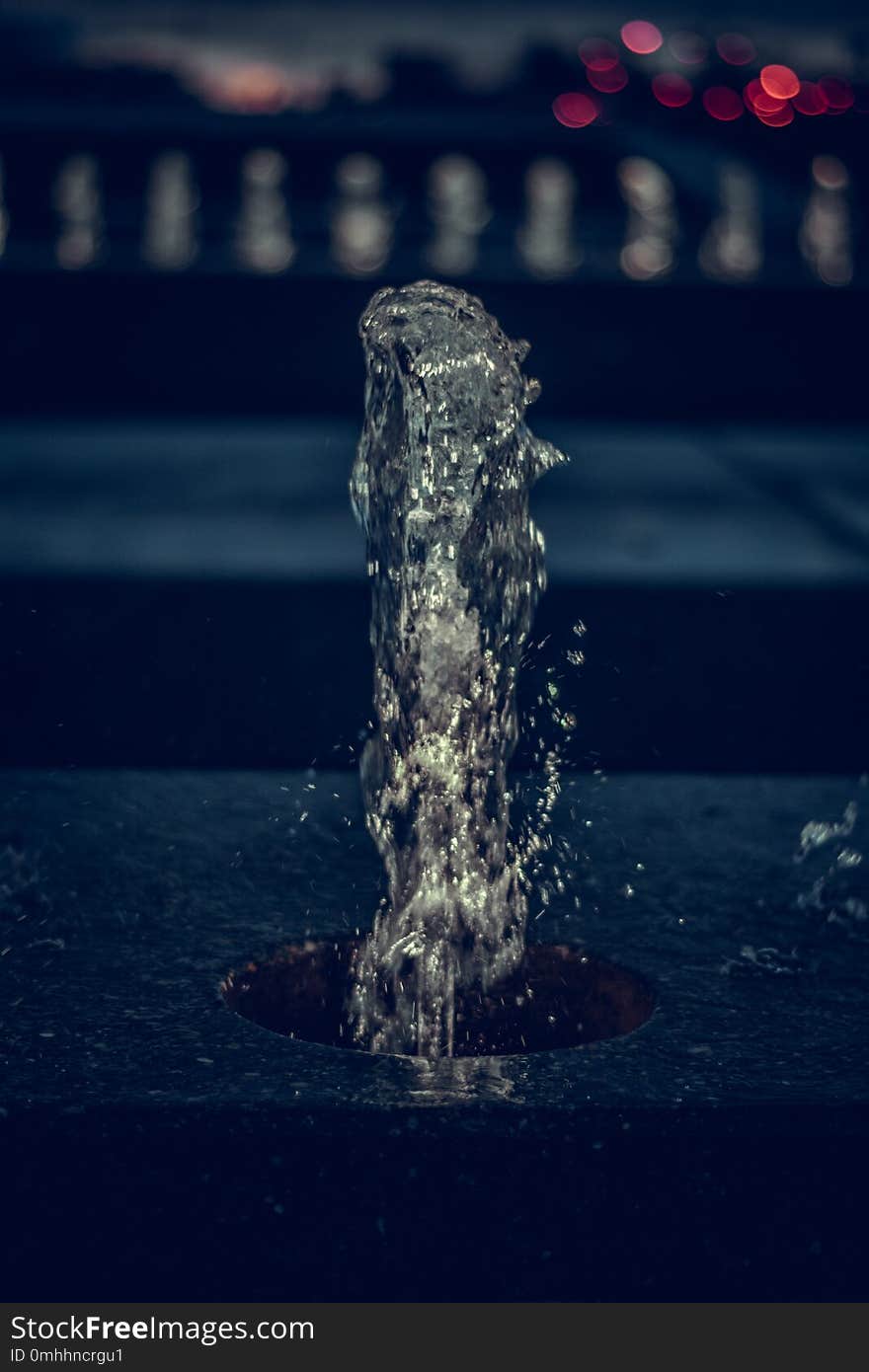 Close Up View Of Fountains Shining In The Night. Shape Of Water.