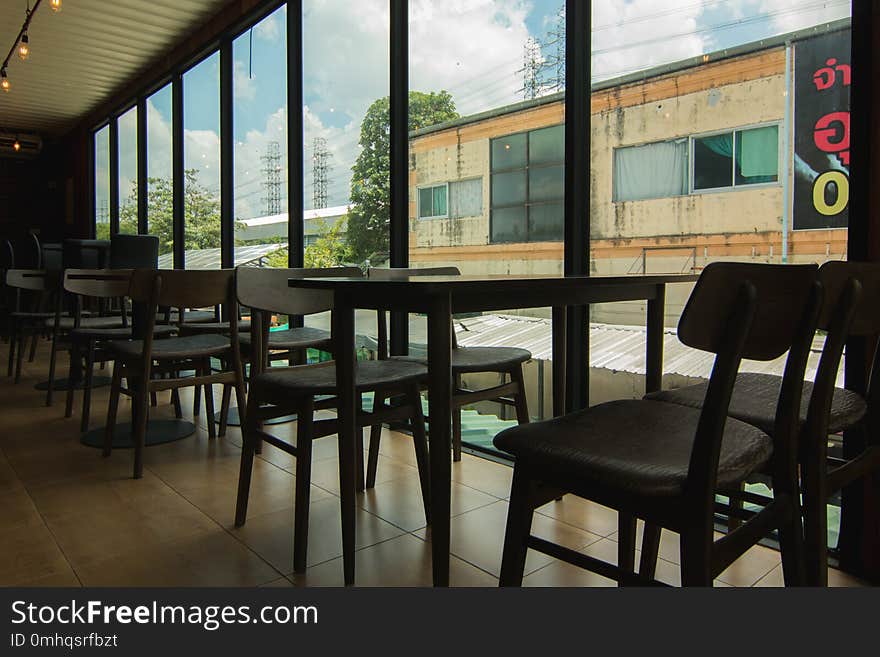 Empty Chair In The Cafe. Silhouette.