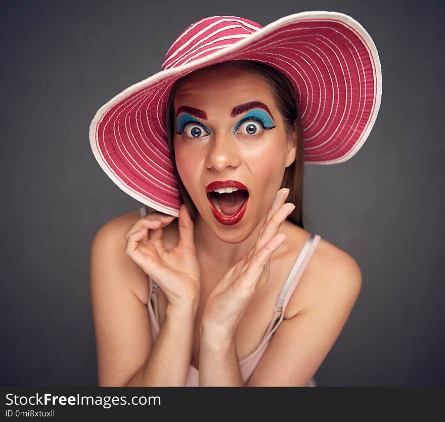 Surprising woman wide angle portrait. Funny close up face.