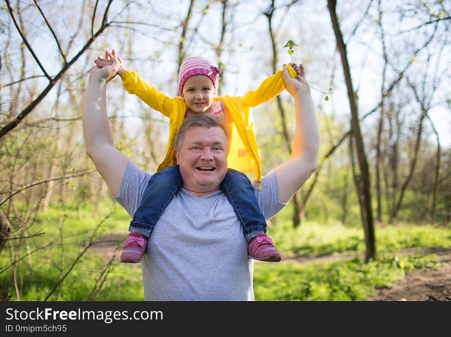 Dad and daughter walking in the woods