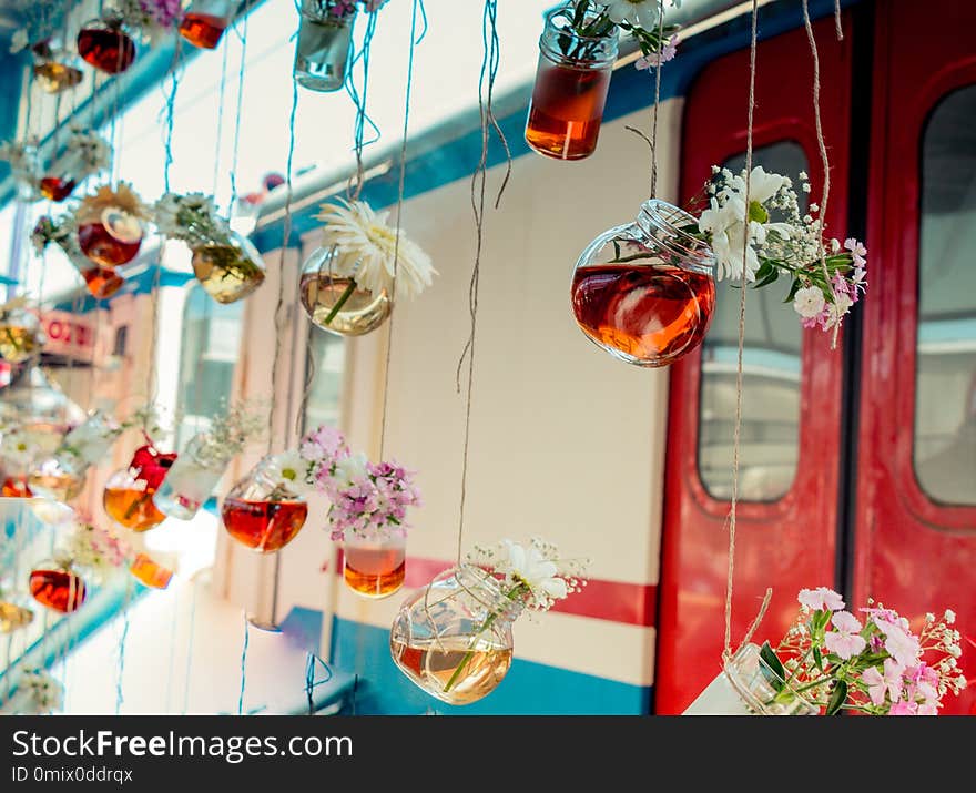 Herbal tea bottles hanging on strings