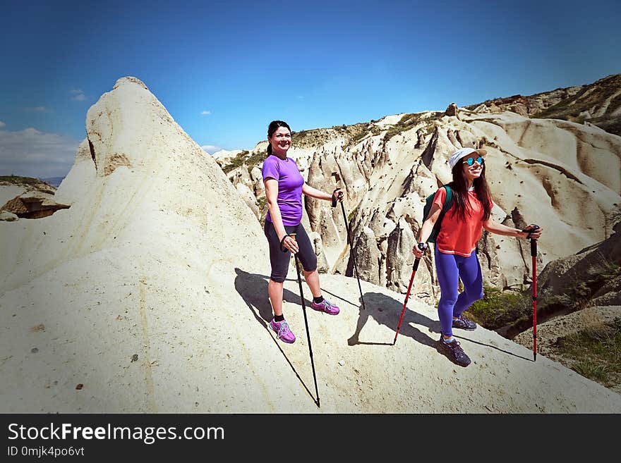 Summer hike in the mountains with a backpack and tent.