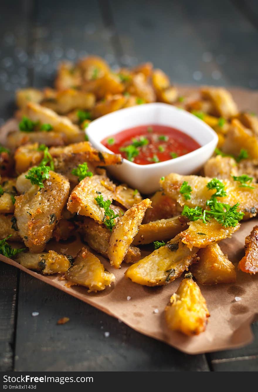 Close-up Of Roasted Potatoes With Rosemary, Parmesan Cheese And Fresh Parsley On Top