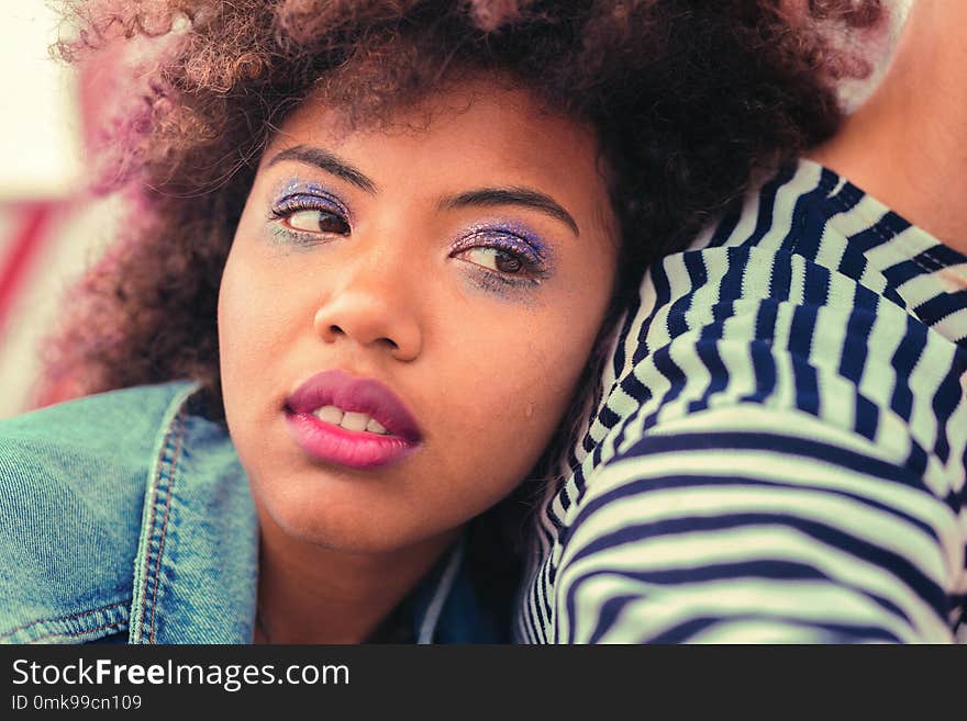 Girl with makeup. Calm young girl feeling tired after long party and thoughtfully looking into the distance. Girl with makeup. Calm young girl feeling tired after long party and thoughtfully looking into the distance