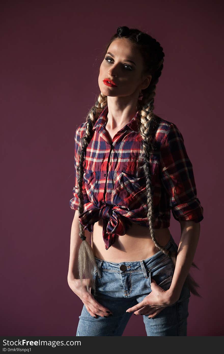 Portrait of a beautiful woman with long braids