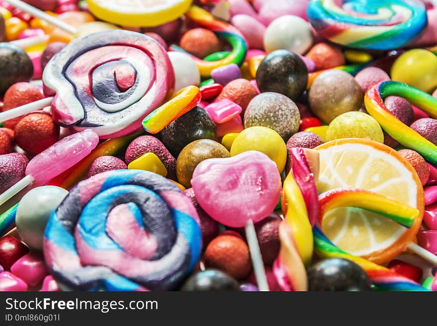 background from variety of sweets, lollipops, chewing gum, candies