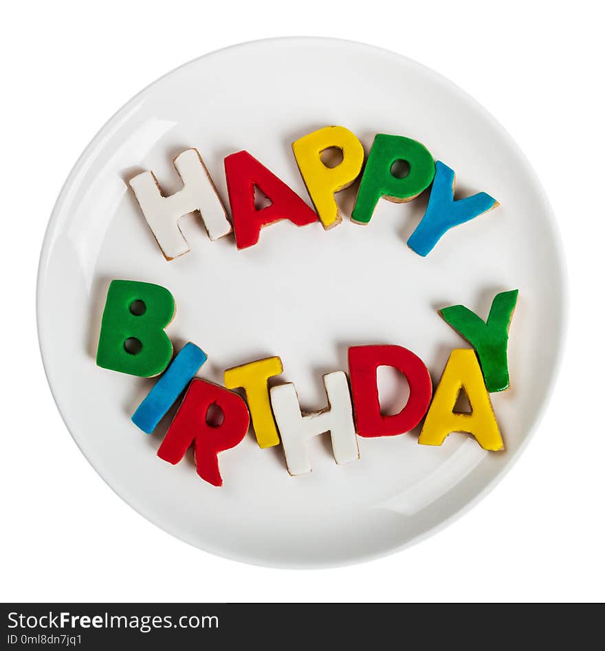 Letters with the word happy birthday from cookies with icing isolated on white background