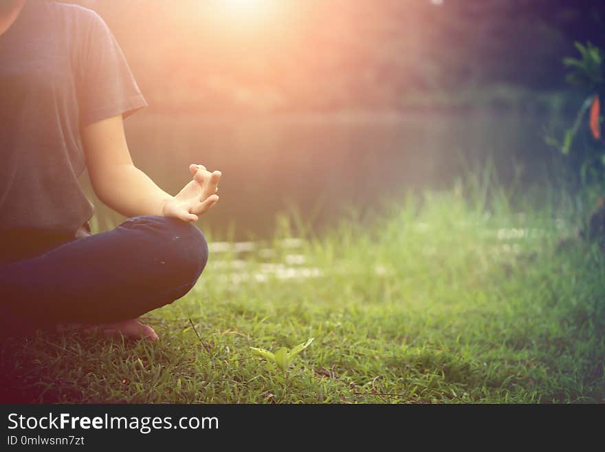 Close up of young woman doing yoga