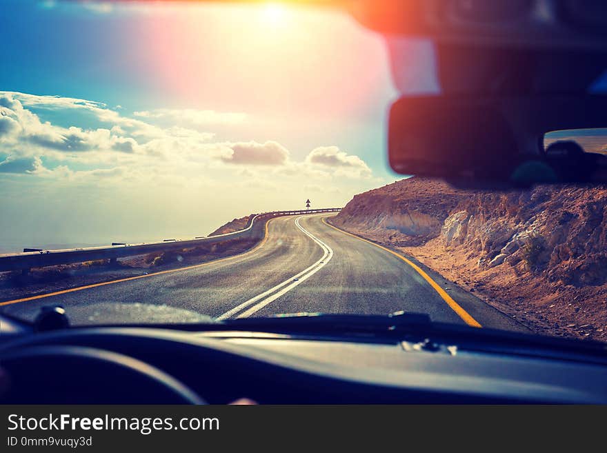 Driving a car on a mountain road