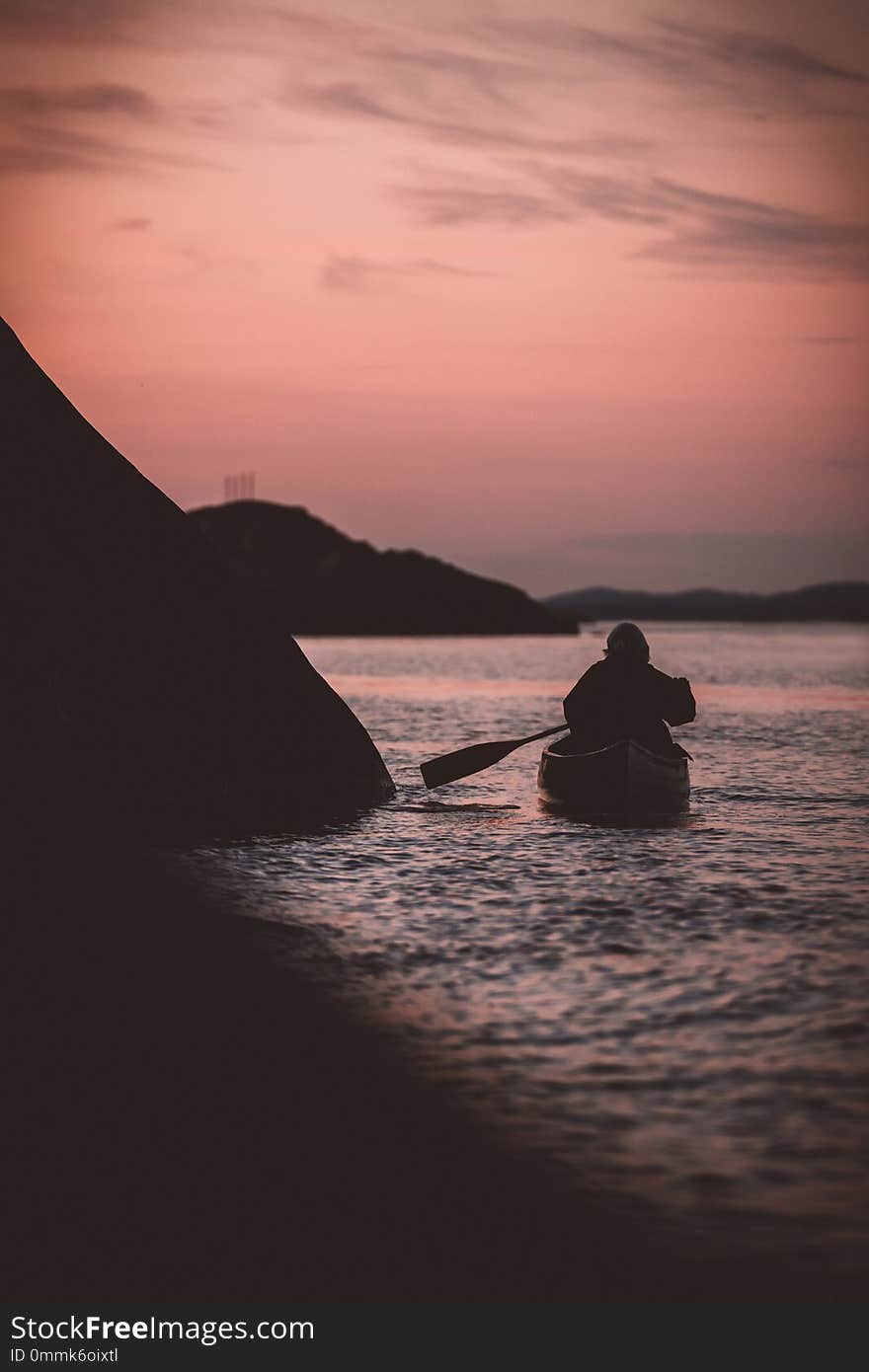 Canoeing on a late night with a sunset