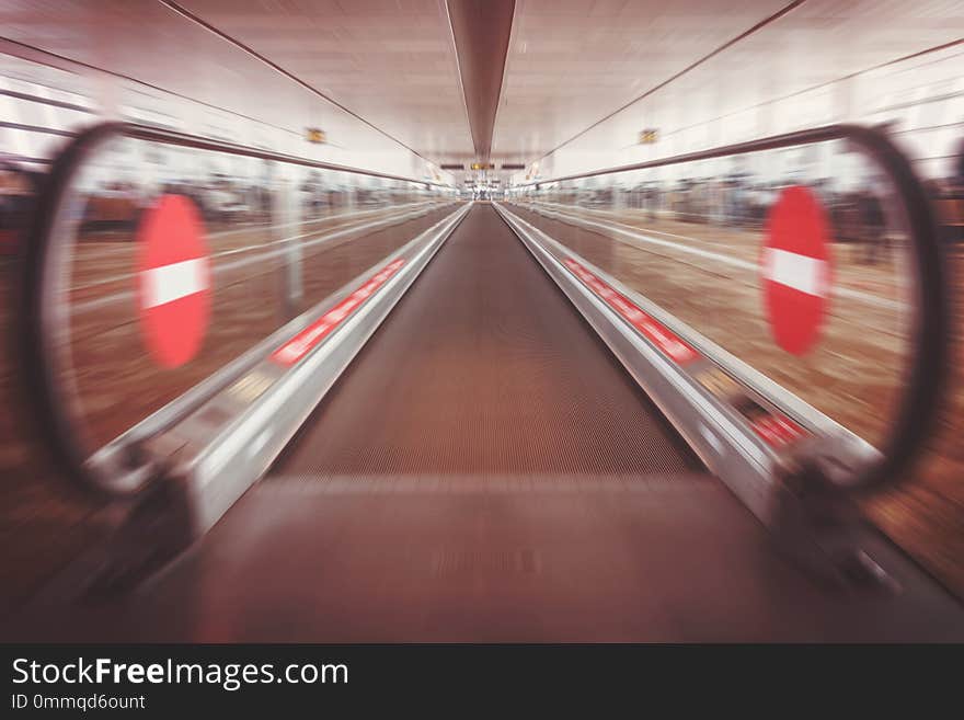 Moving waklway in the airport terminal, travel concept