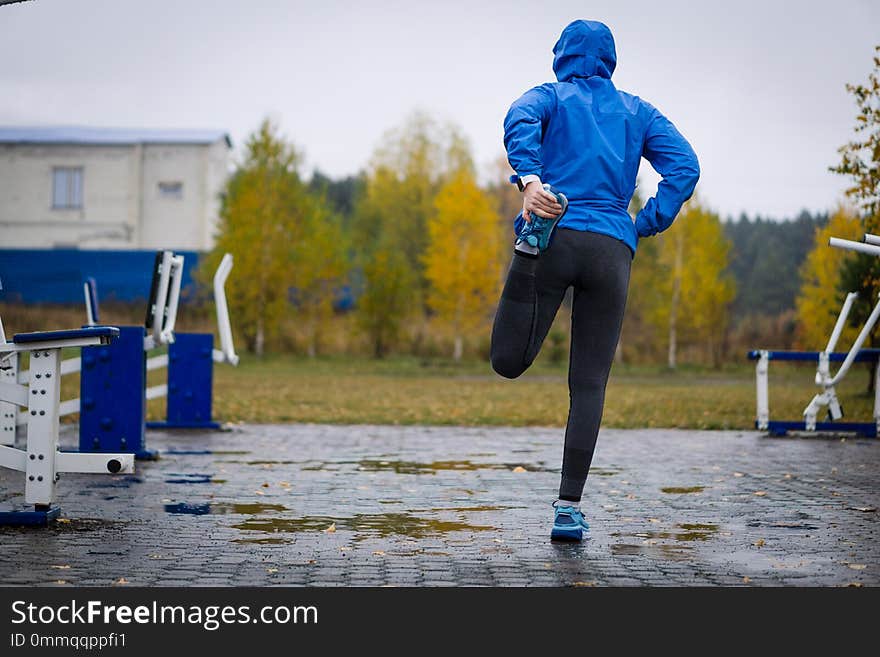 Fitness Woman Runner Stretching Legs Before Run. Fit And Healthy.