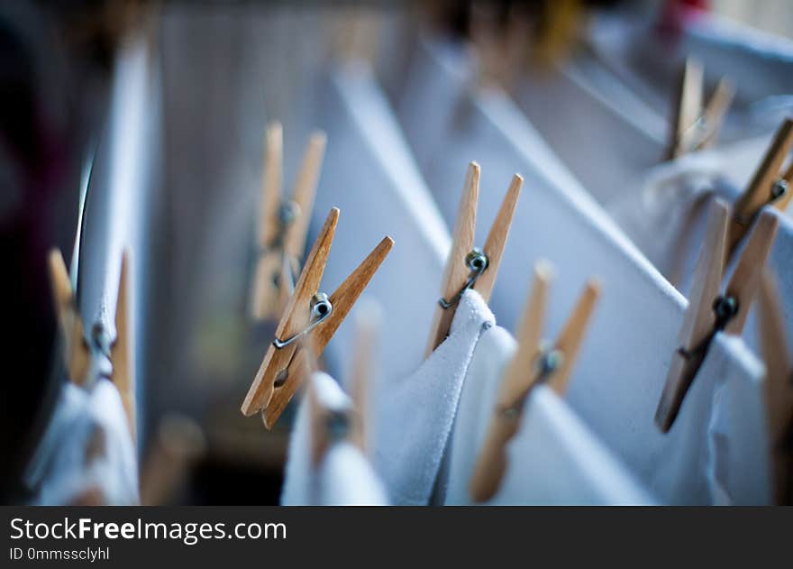 Clothes pegs on the clothesline with cotton white clothes