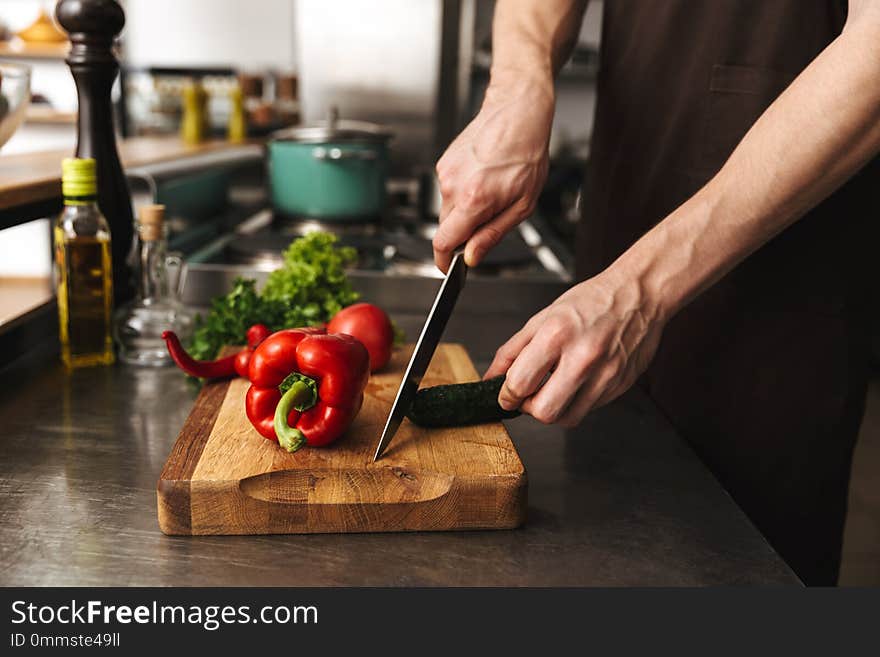 Close Up Of A Man Hands Chopping Vegetables