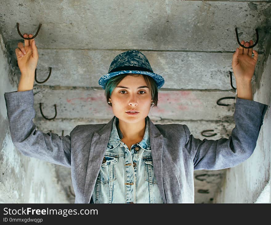 Portrait of a young woman in a hat and jacket. Street style.