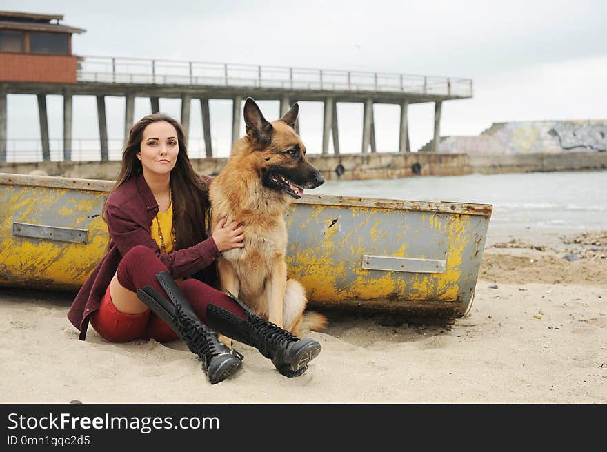 Happy casual woman portrait hug her German shepherd dog