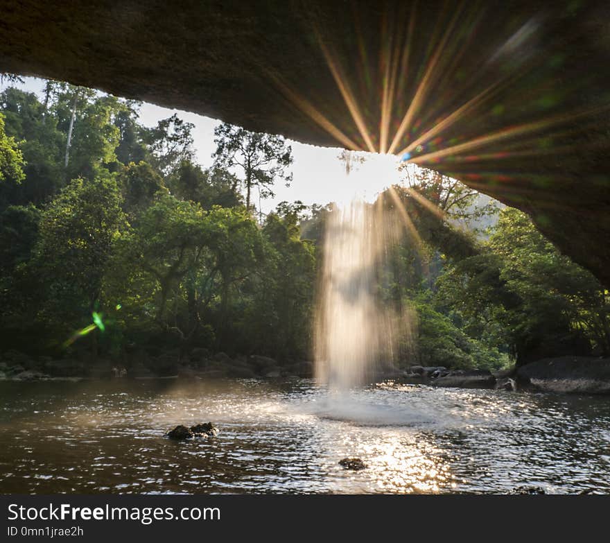 View from cave at Beautiful waterfall with sunlight in jungle, Haew Suwat Waterfall. Khao Yai National Park