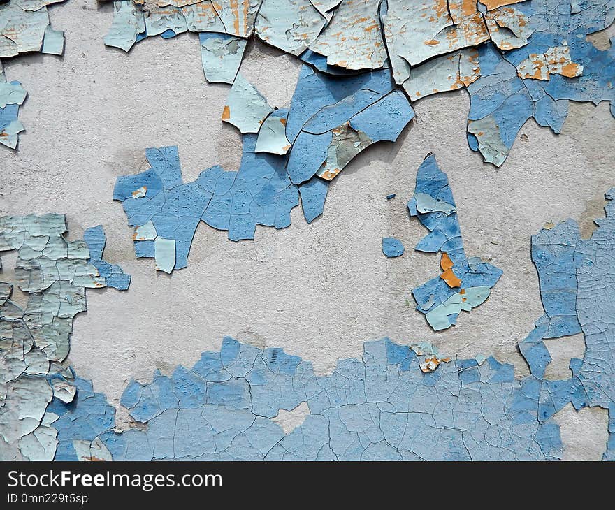 Old wall stucco with scratches and cracks. Textured background.