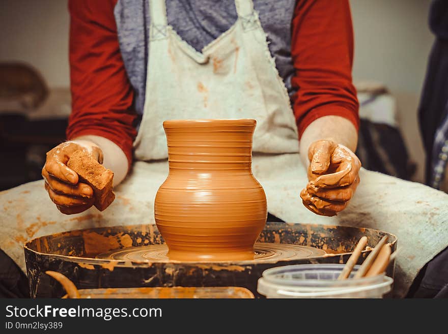 Potter at work. makes a jug out of clay. Potter at work. makes a jug out of clay