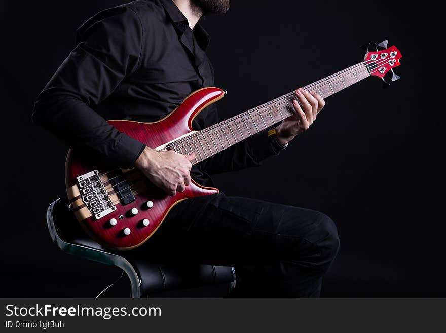 Man Playing Electric Bass Guitar with Slap Technique