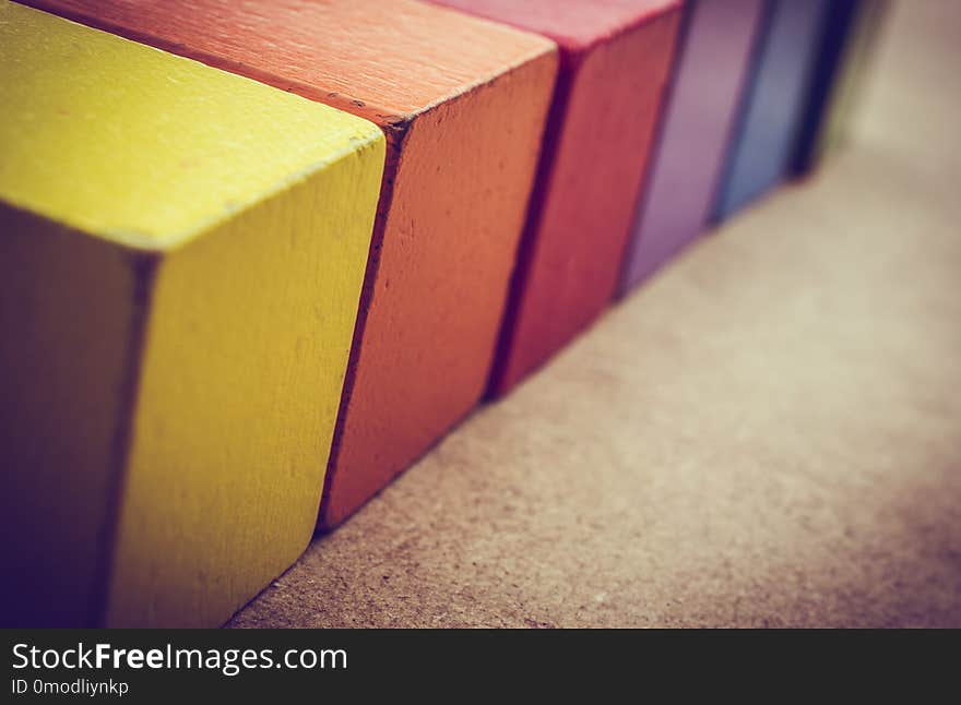 Colorful building blocks on a brown background