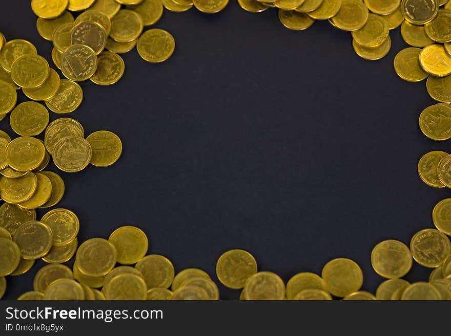 Piles of coins on black background, business and financial concept.