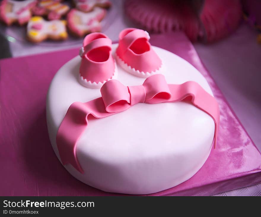 Beautiful children`s pink cake for a newborn girl