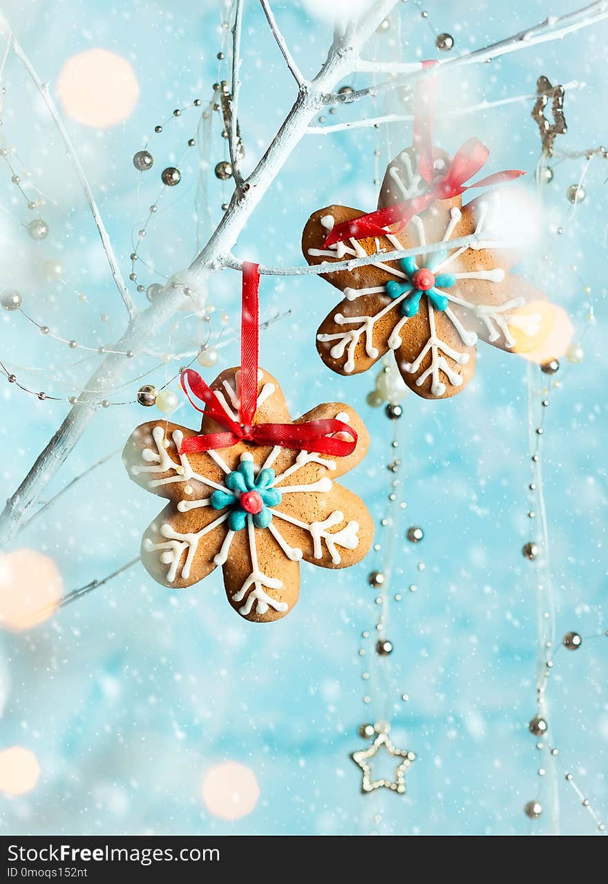 Gingerbread snowflakes for Christmas hanging on a twig